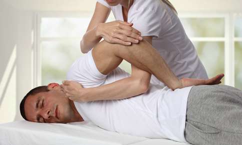 Man receiving chiropractic treatment