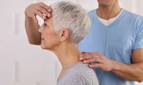 Woman receiving chiropractic treatment