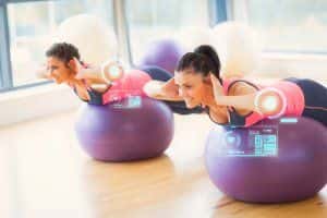 image of couple using exercise balls.