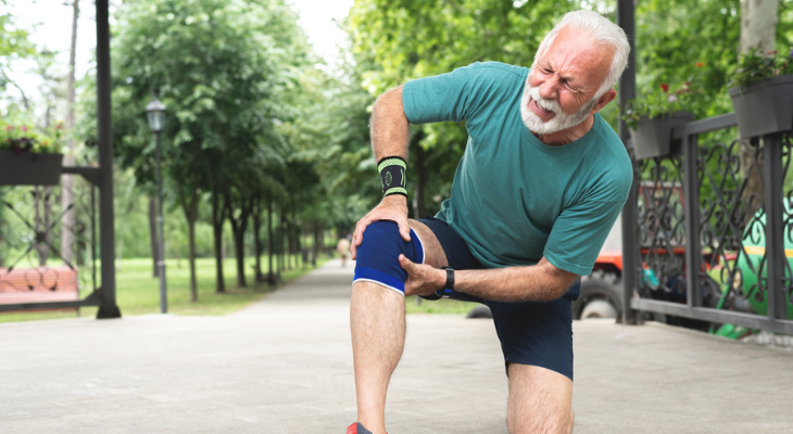 Senior man deals with knee pain.